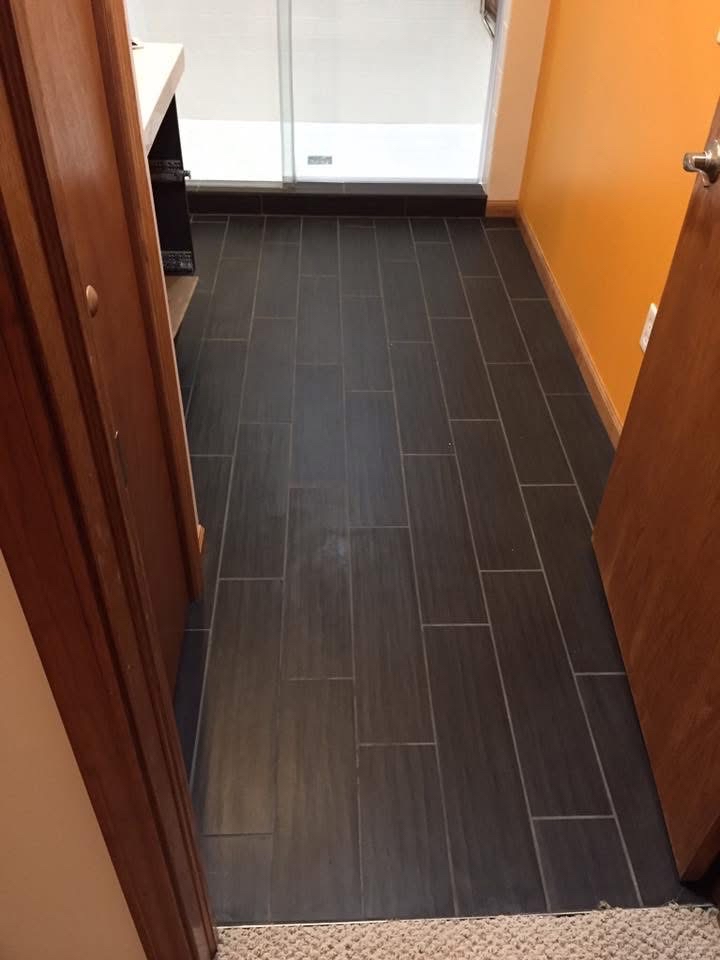 Dark plank floor tile installation bathroom Kalamazoo MI