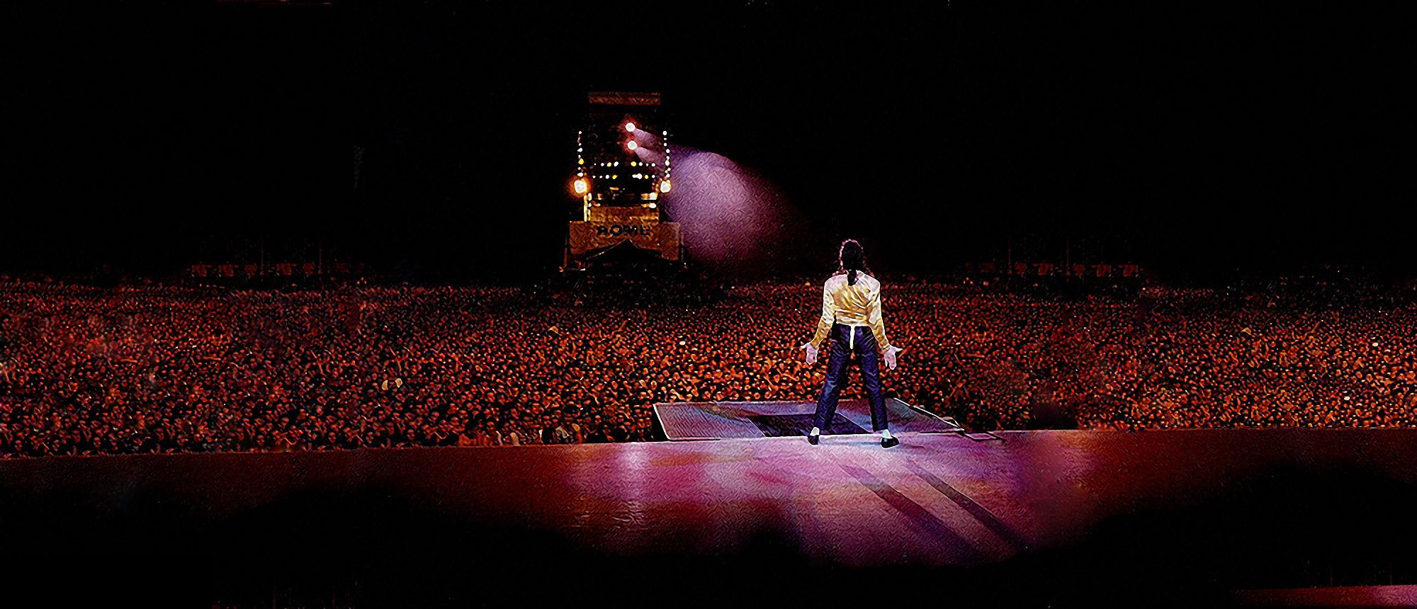 Michael Jackson performing on stage in his iconic pose