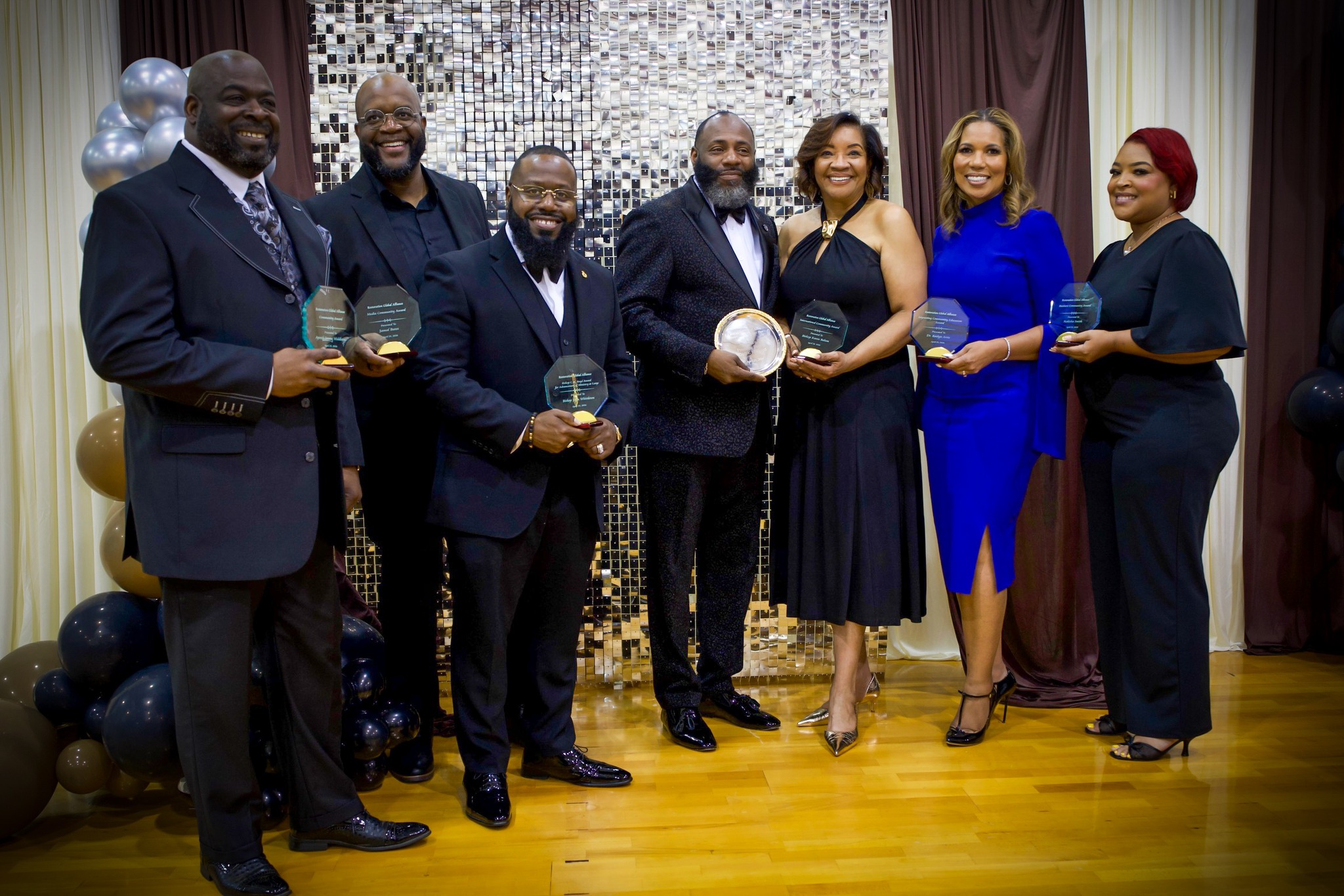 Restoration Global Alliance leaders celebrating at an awards gala