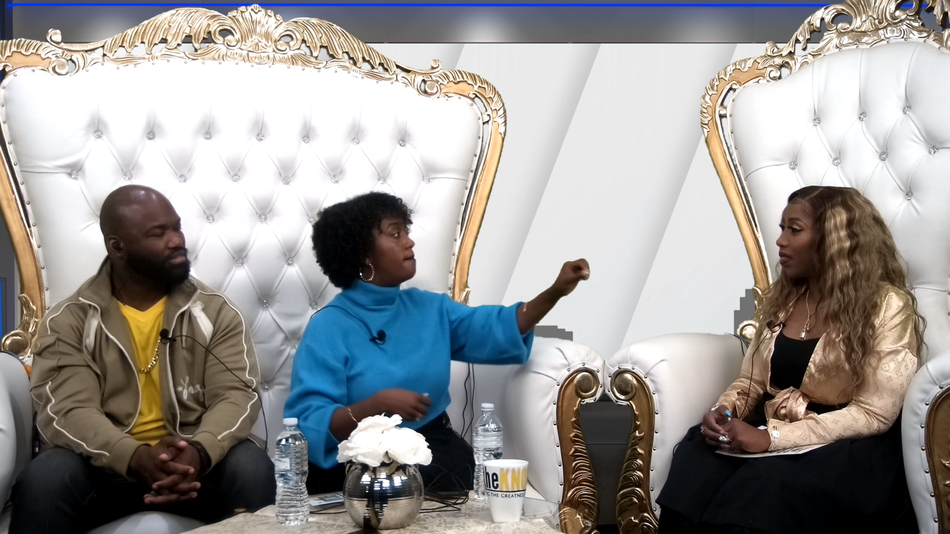 Multi-guest talk show set produced by Blazing Blaine — luxury throne chairs, professional lighting, branded mug, and multi-camera setup