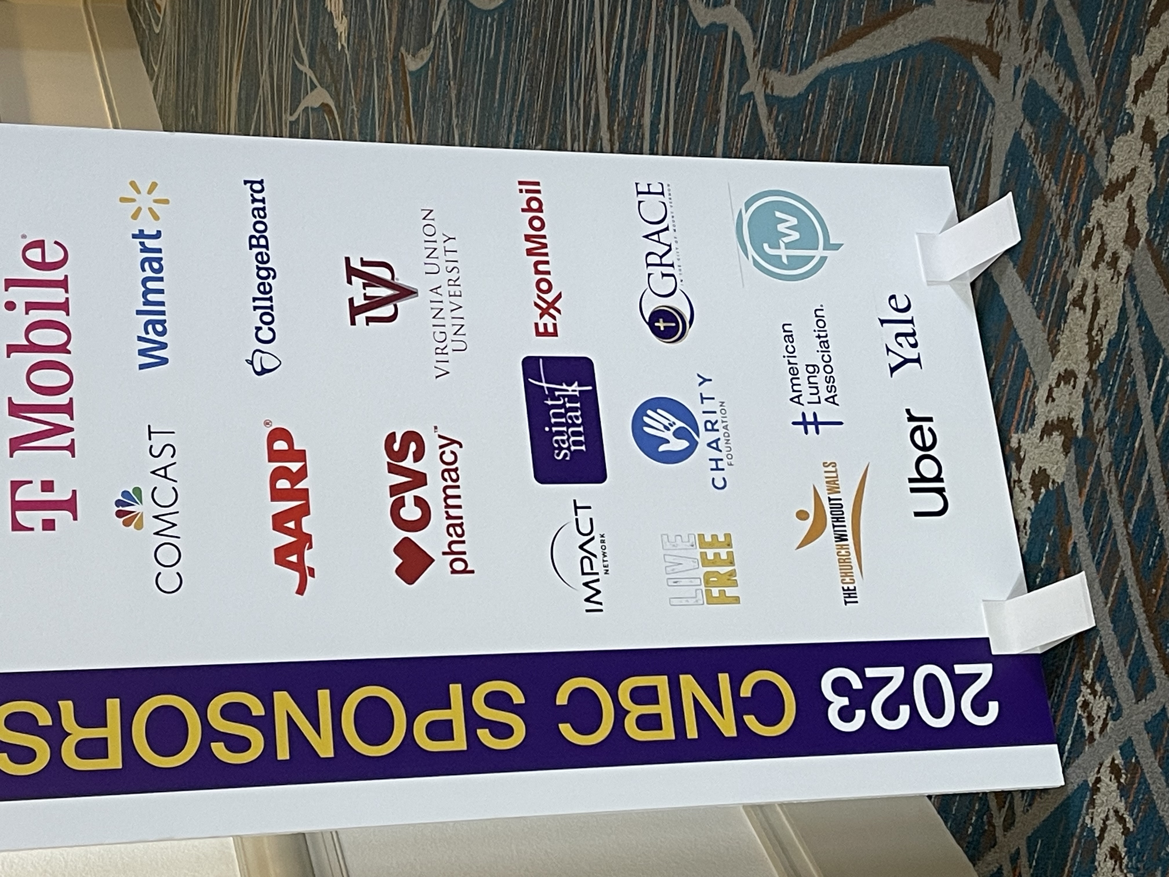 2023 CNBC Sponsors board featuring T-Mobile, Comcast, Walmart, AARP, ExxonMobil, CVS, Uber and Yale