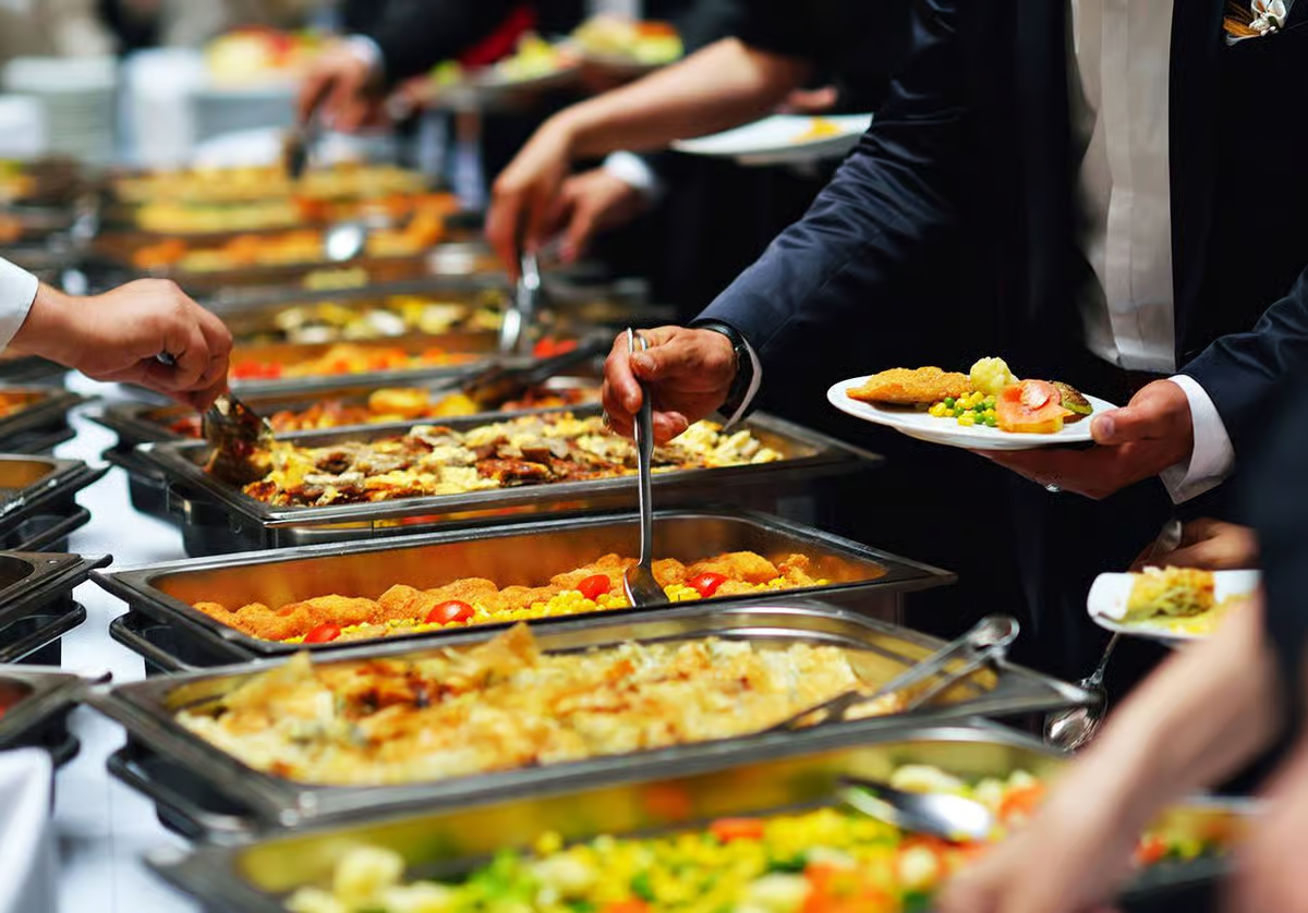 Catering buffet spread with chafing dishes at a Raso's catered event
