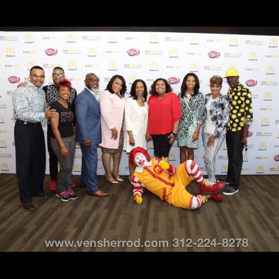 McDonald's 365Black event — Farmedia team and partners posing with Ronald McDonald on the step-and-repeat banner